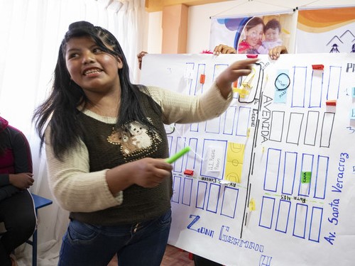 In Bolivia, 20-year-old Fanny helps lead a community mapping session at a ChildFund-supported youth center in her neighborhood.