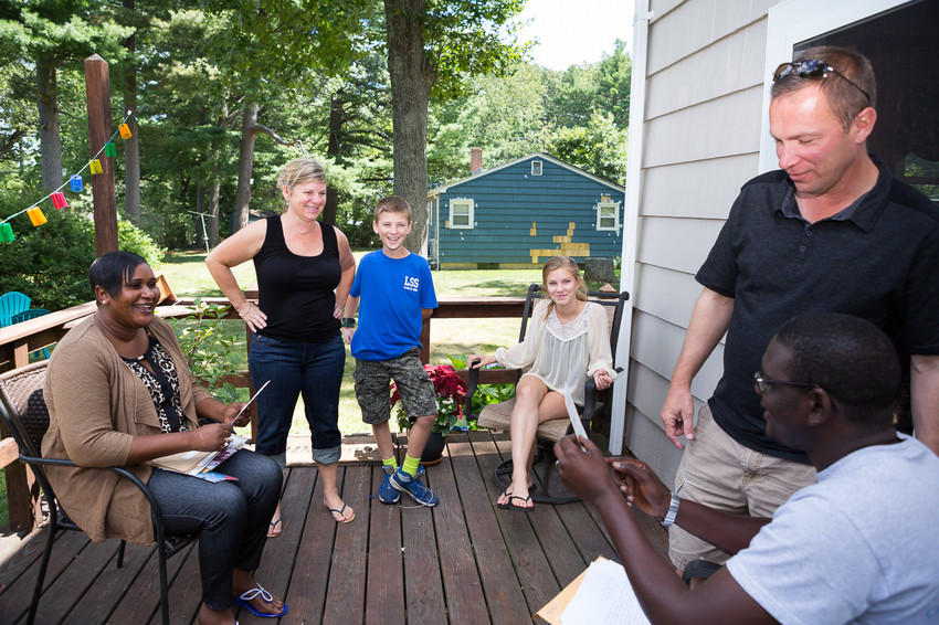 Momodou M. Bah of the Gambia and his sister Sunkaru Bah spend time with Deborah and Paul Bourque and their kids Natalie and Jack at their house in Northborough, MA on August 8, 2015.